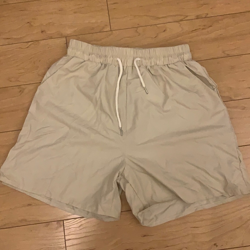 Beige woven athletic shorts
